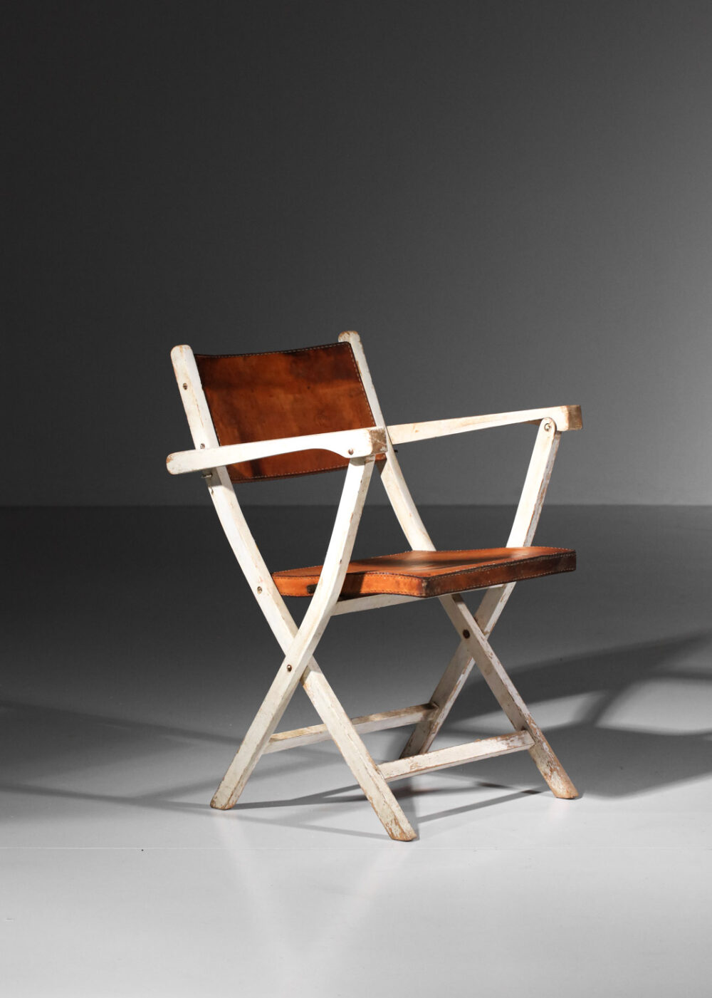 chaise pliable des années 40 en cuir et bois laqué I229
